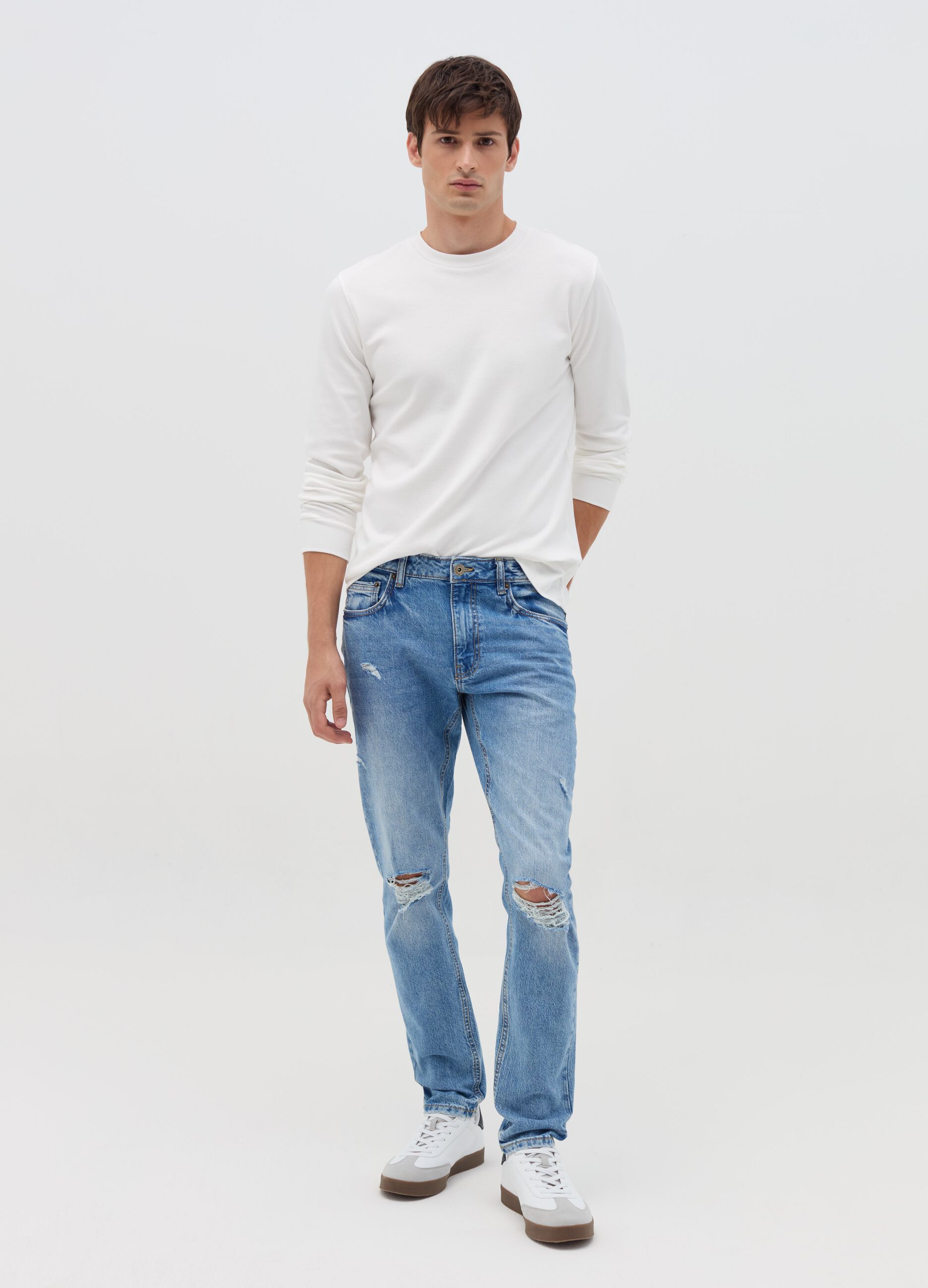 Slim-fit acid-wash jeans with abrasions