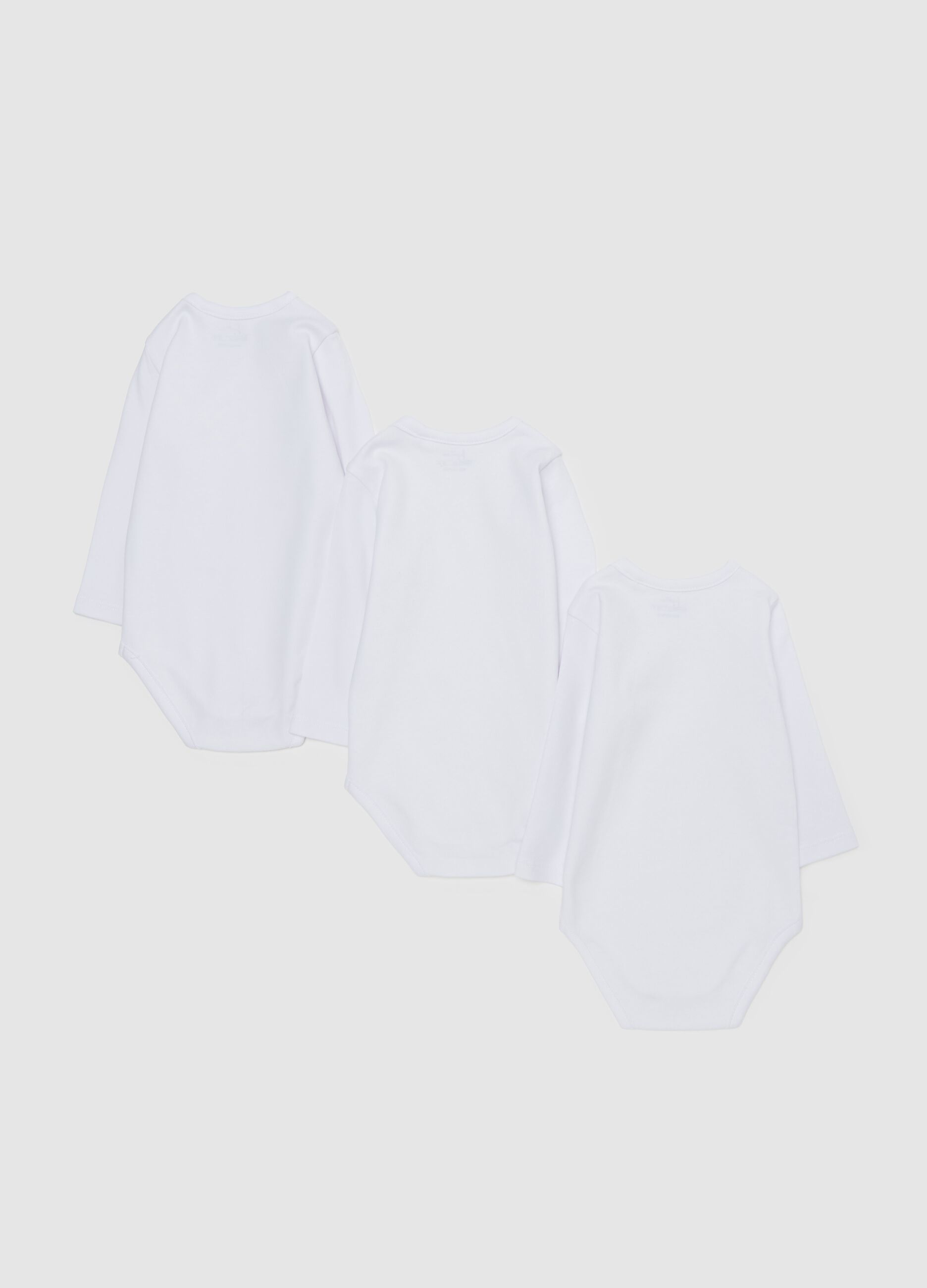 Three-pack solid colour bodysuits in organic cotton