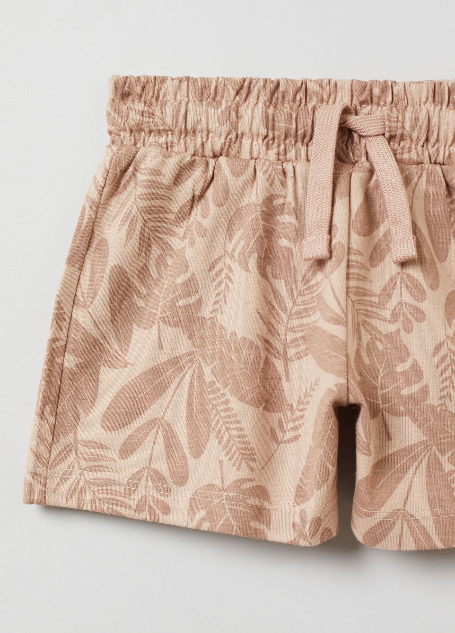 Shorts with all-over tropical leaves print