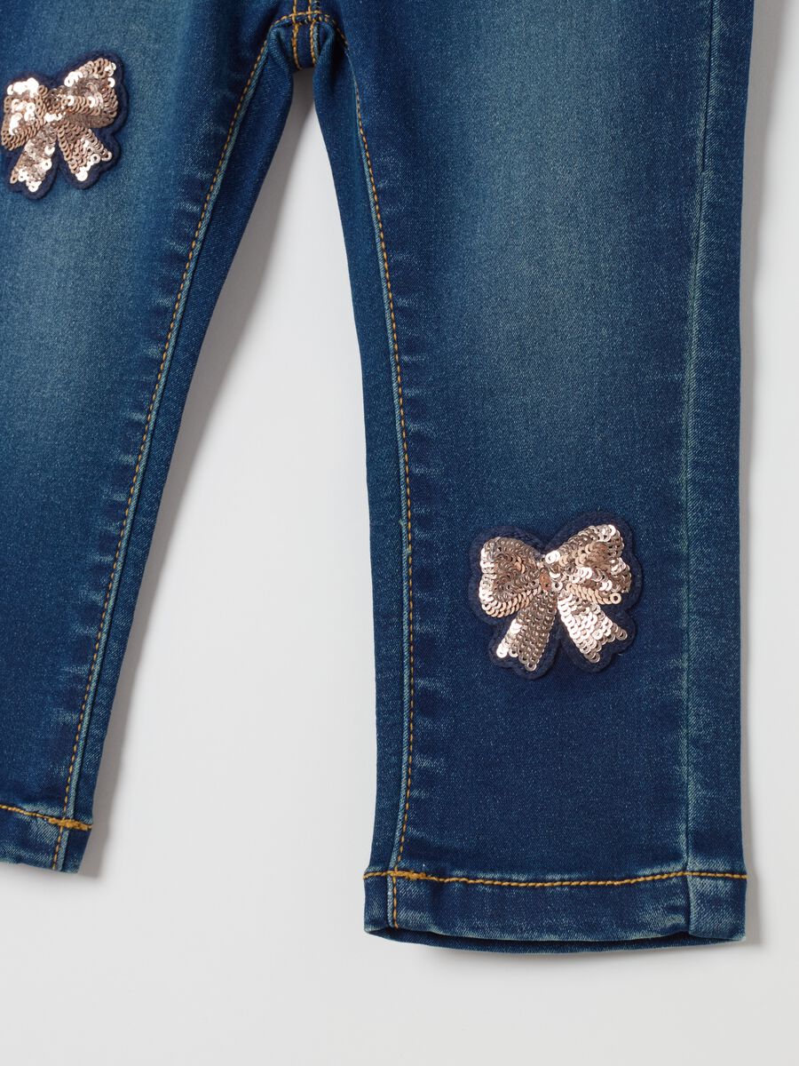 Slim-fit jeans with sequinned bows_3