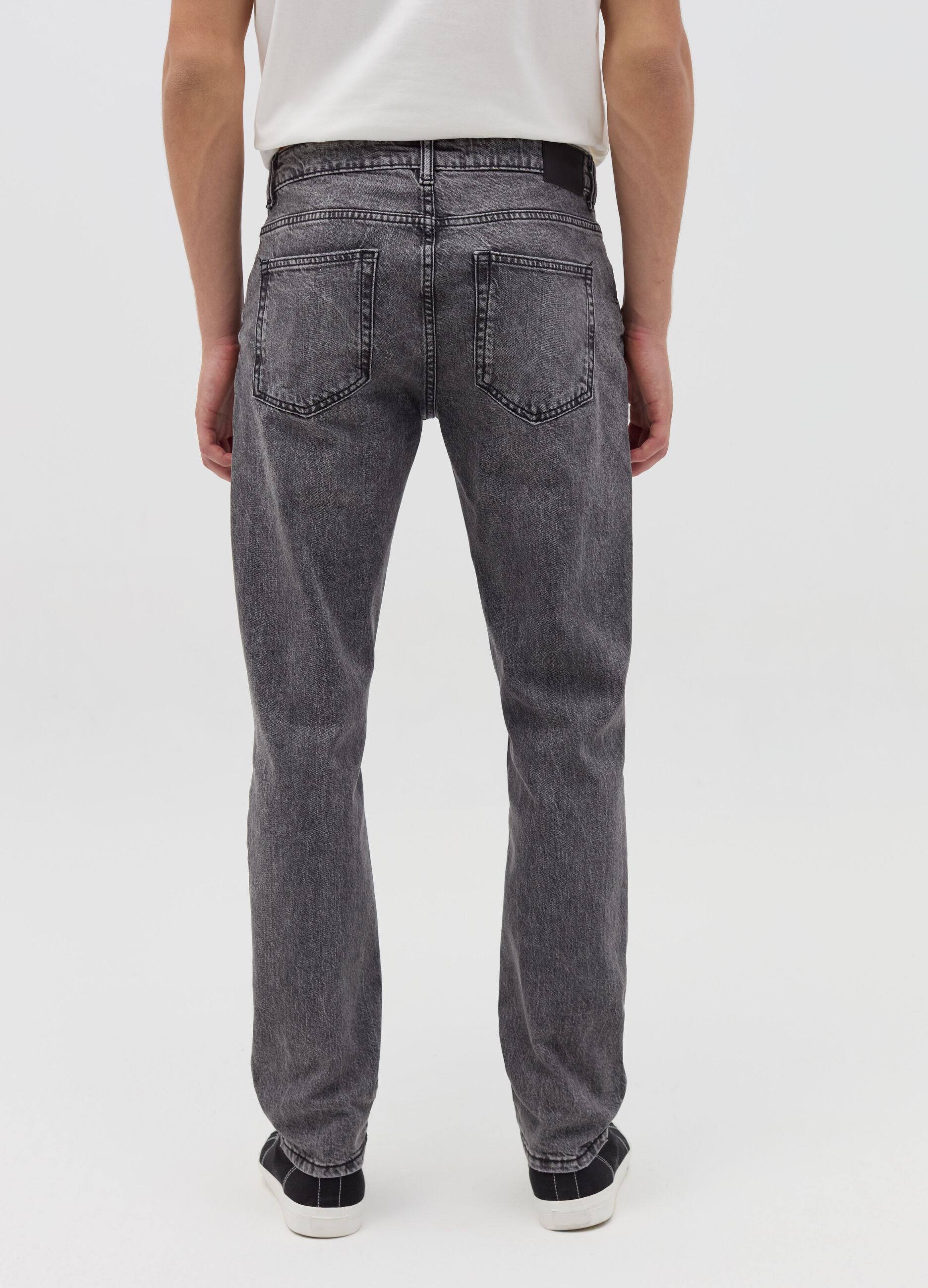 Slim-fit acid-wash jeans with abrasions