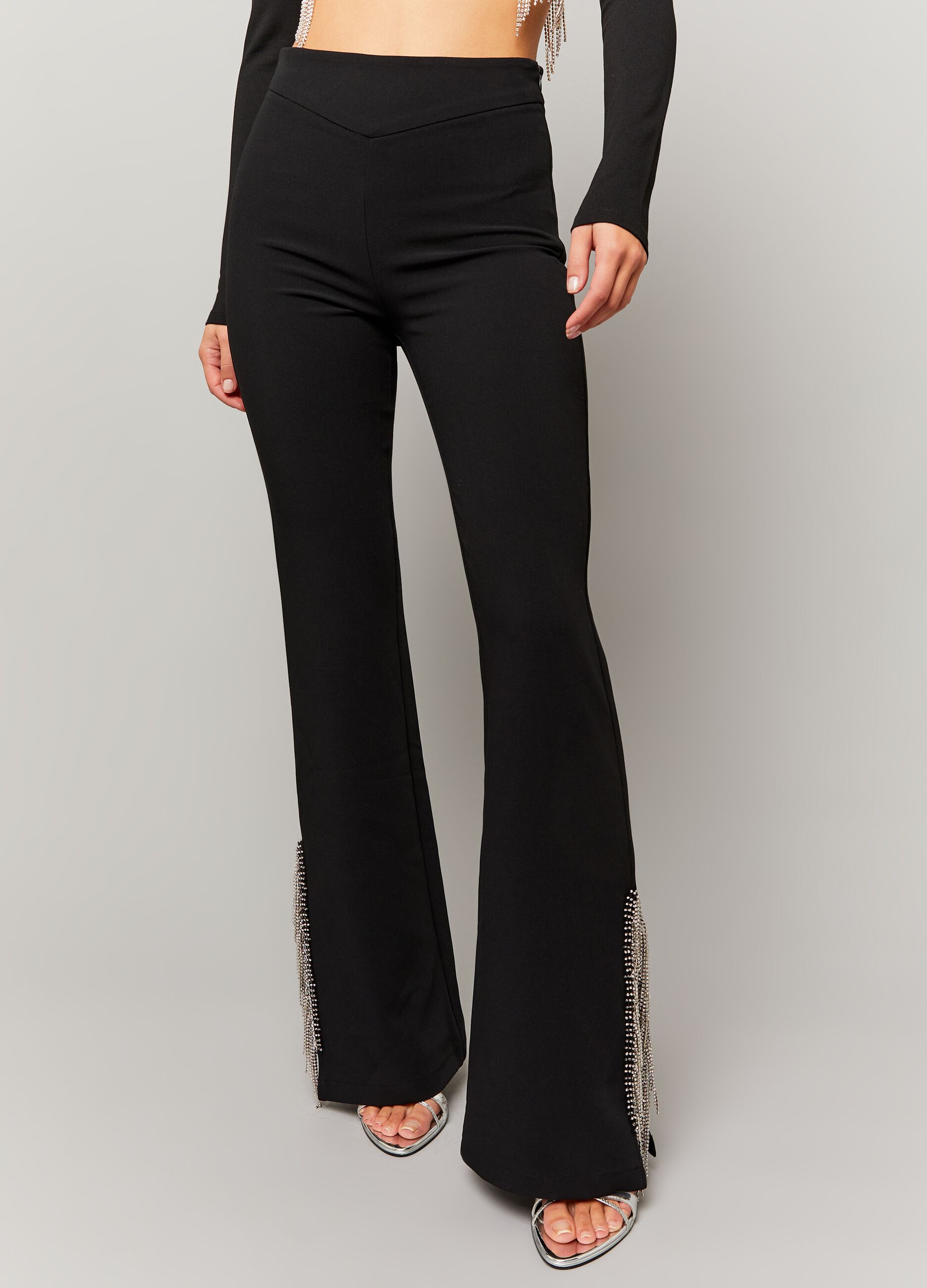 Flare-fit trousers with fringes in diamantés