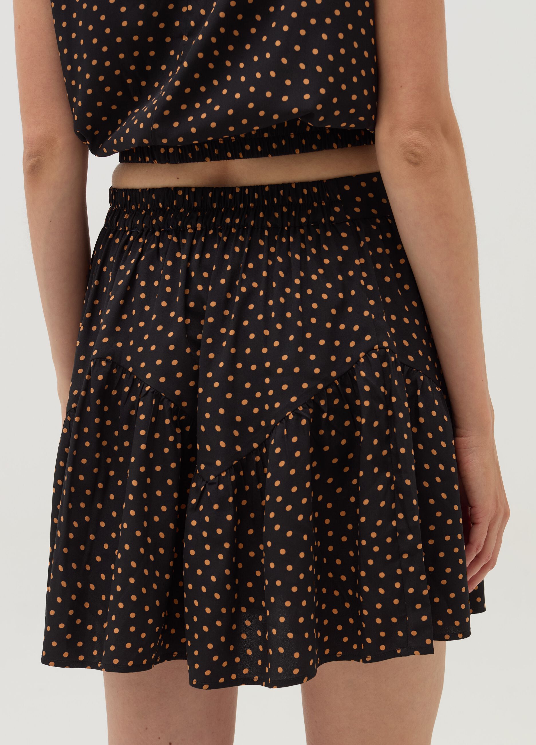 Short polka dot skirt with flounce