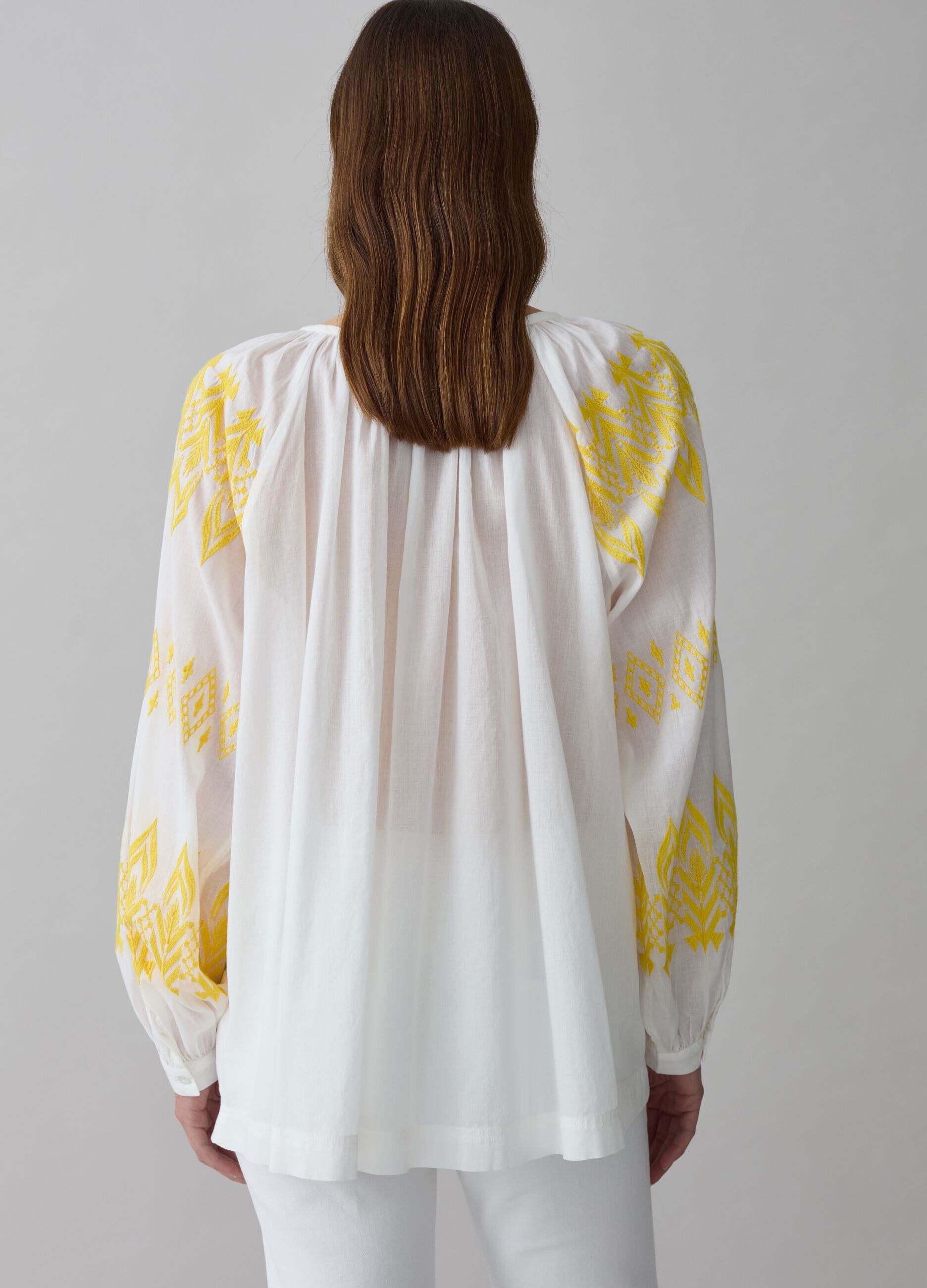 Oversized blouse with ethnic embroidery and tassels