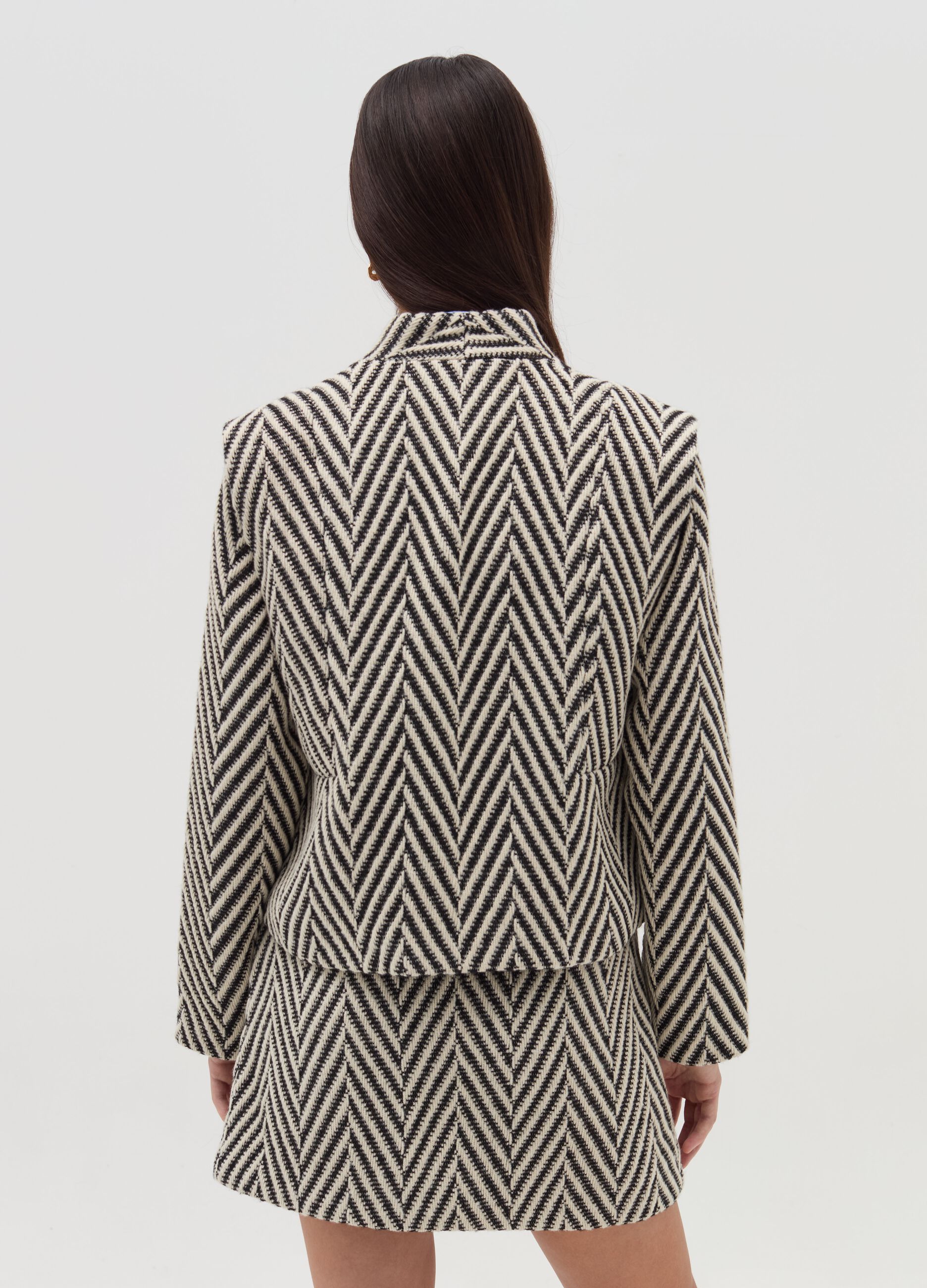 Short open jacket with chevron motif