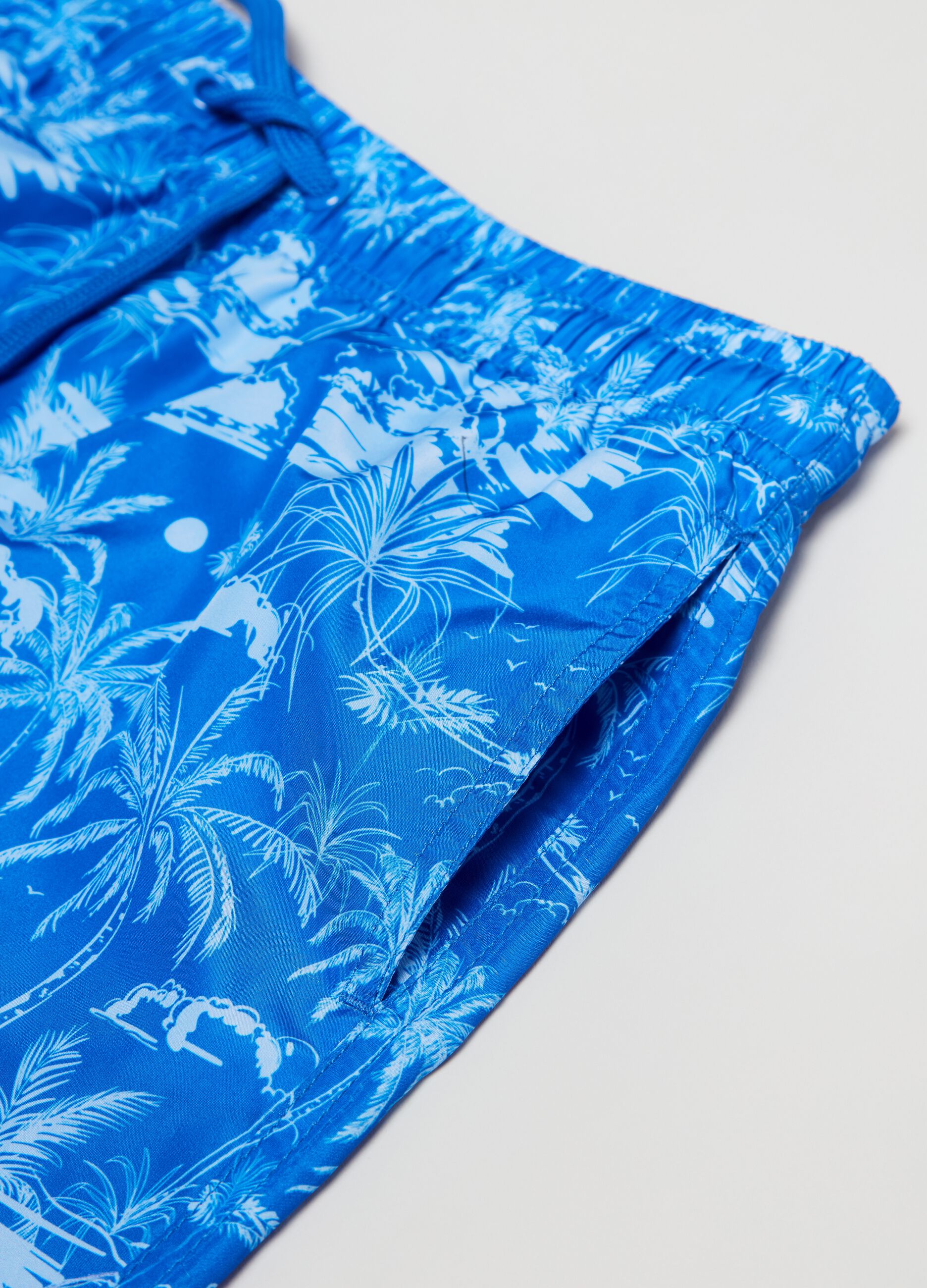 Swimming trunks with palms print
