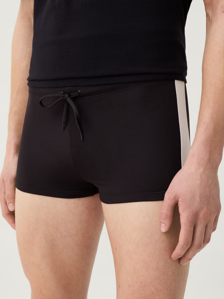 Swimming trunks with side bands_2
