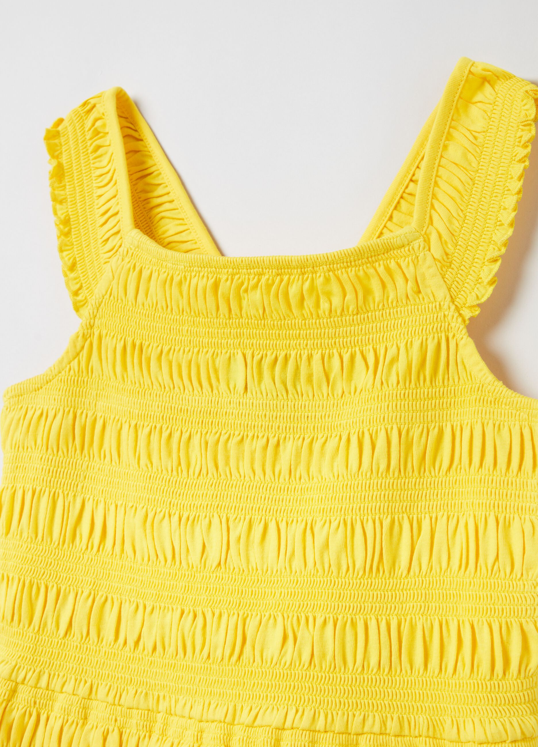 Sleeveless dress in smock stitch