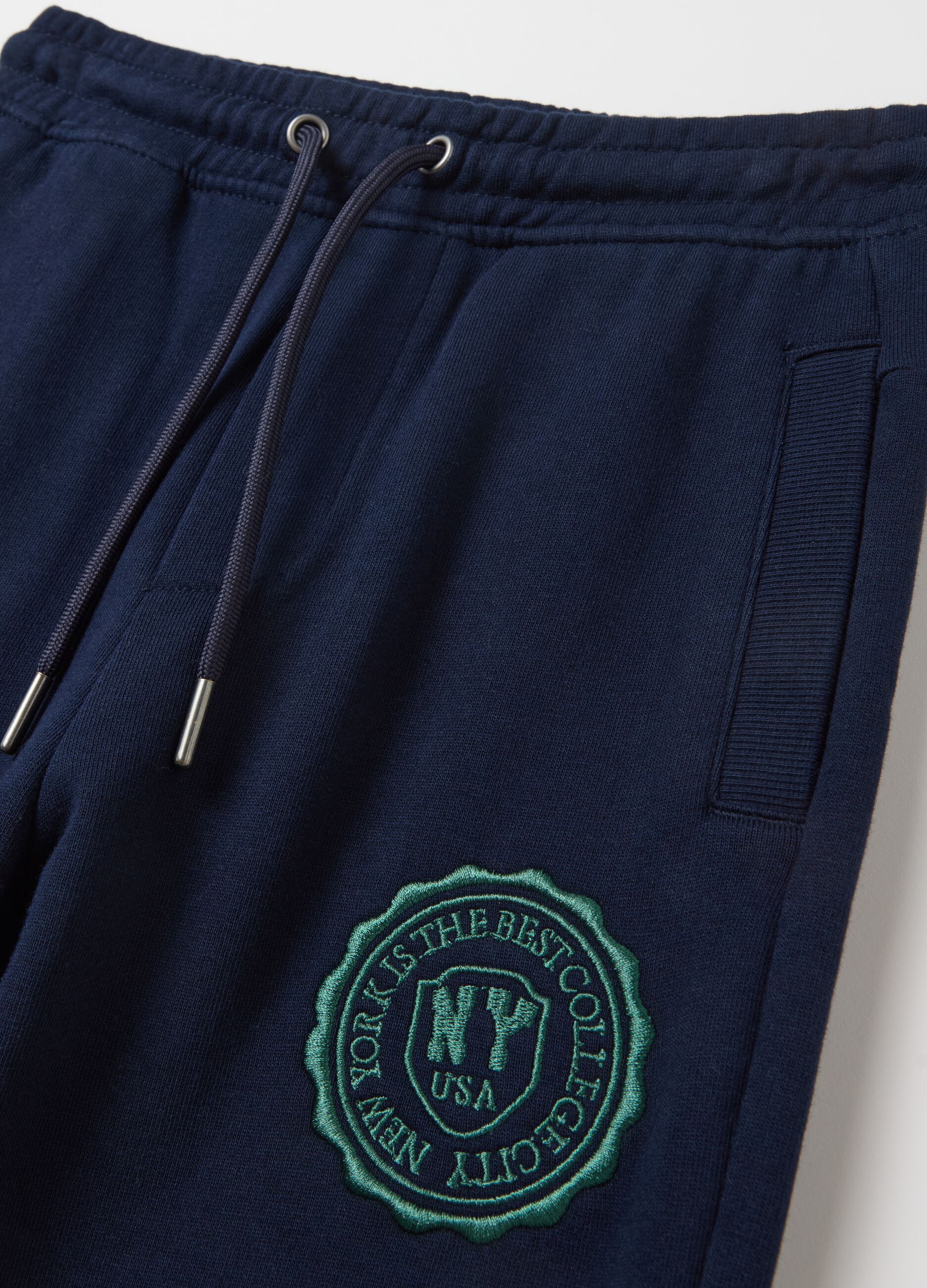 Fleece joggers with drawstring and college embroidery