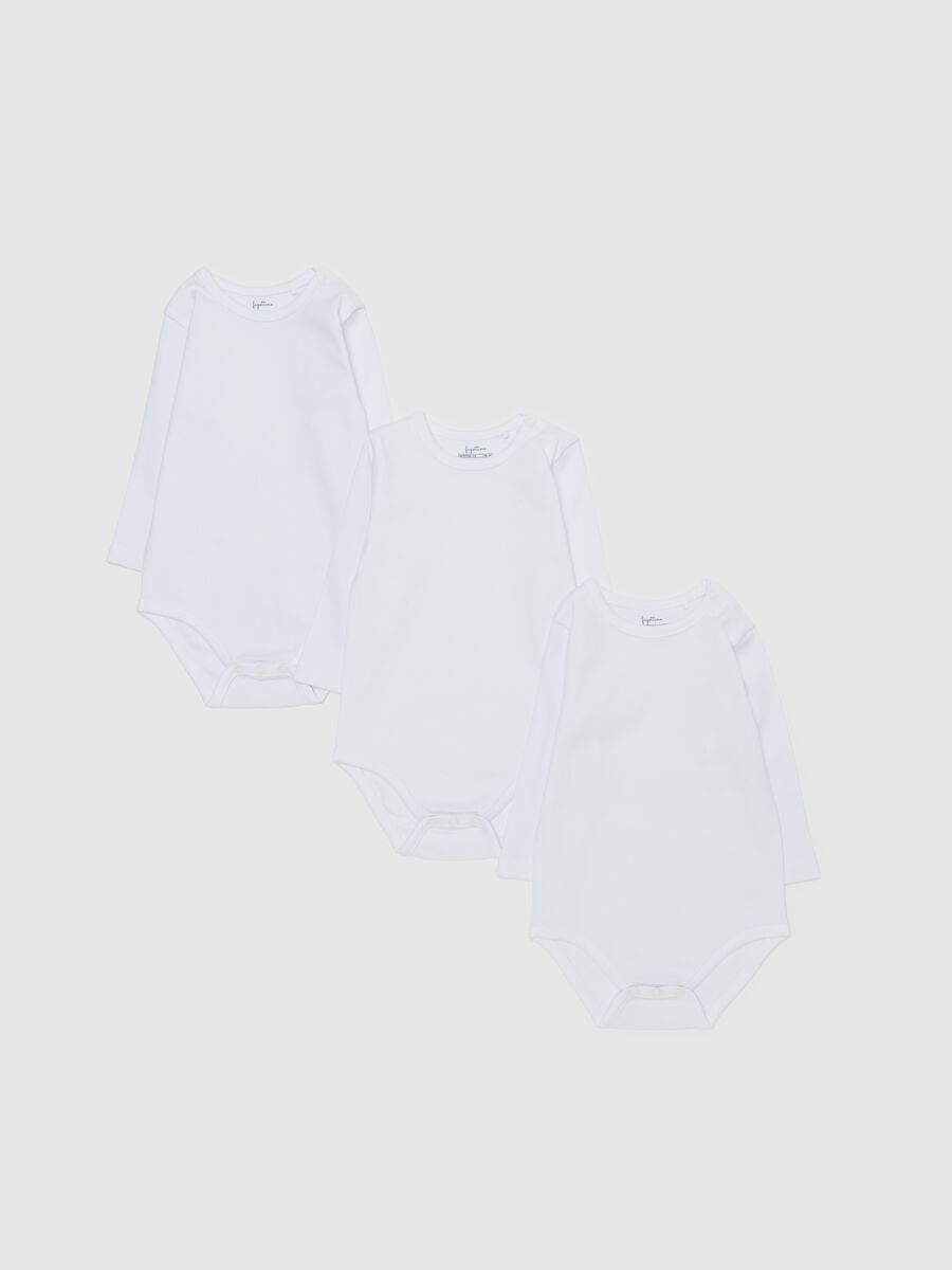 Three-pack solid colour bodysuits in organic cotton_0