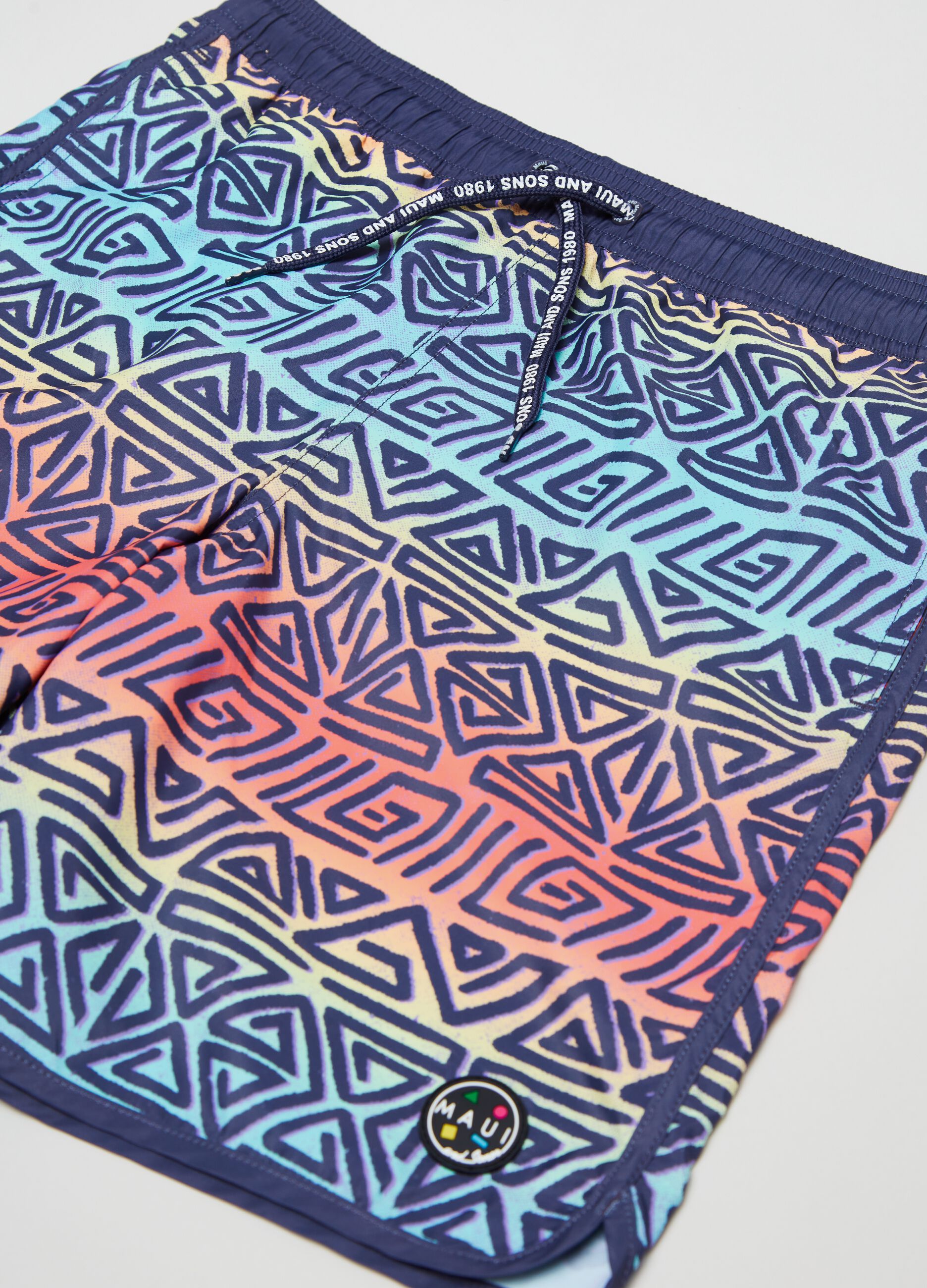 Swimming trunks with Maui and Sons print