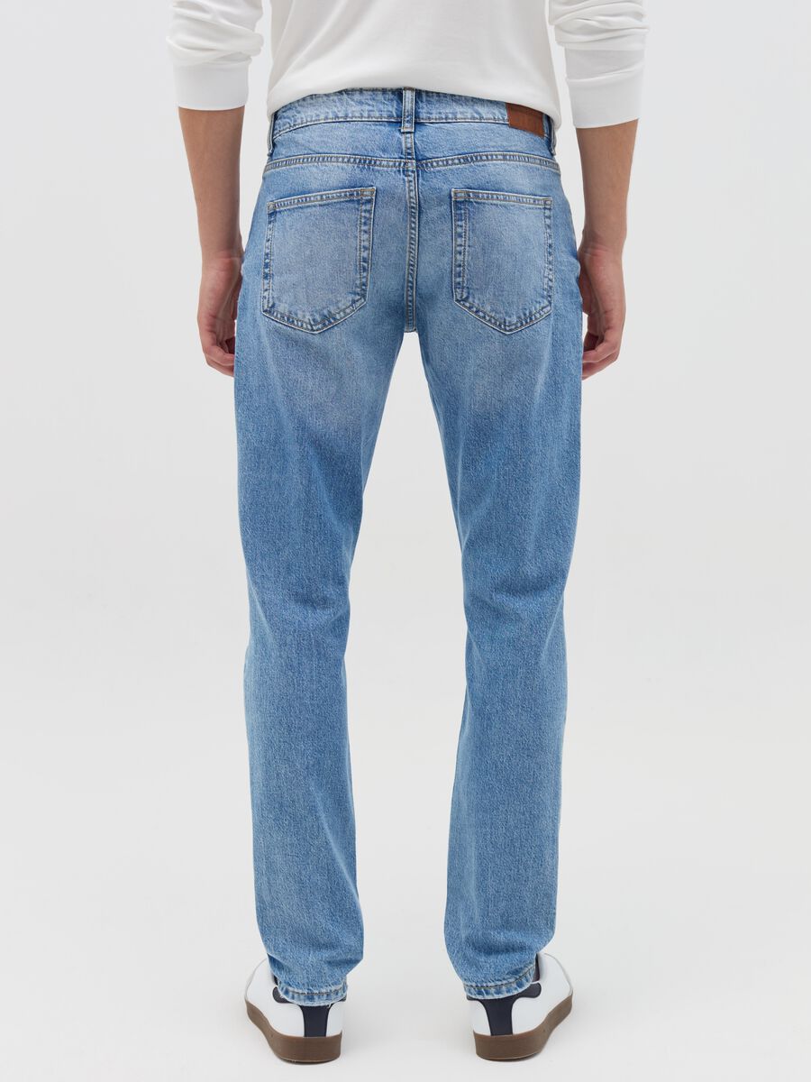 Slim-fit acid-wash jeans with abrasions_3