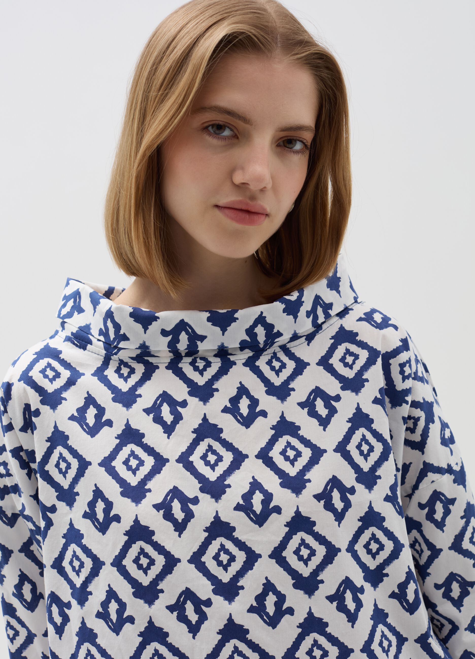 Blouse with folded collar and ikat print