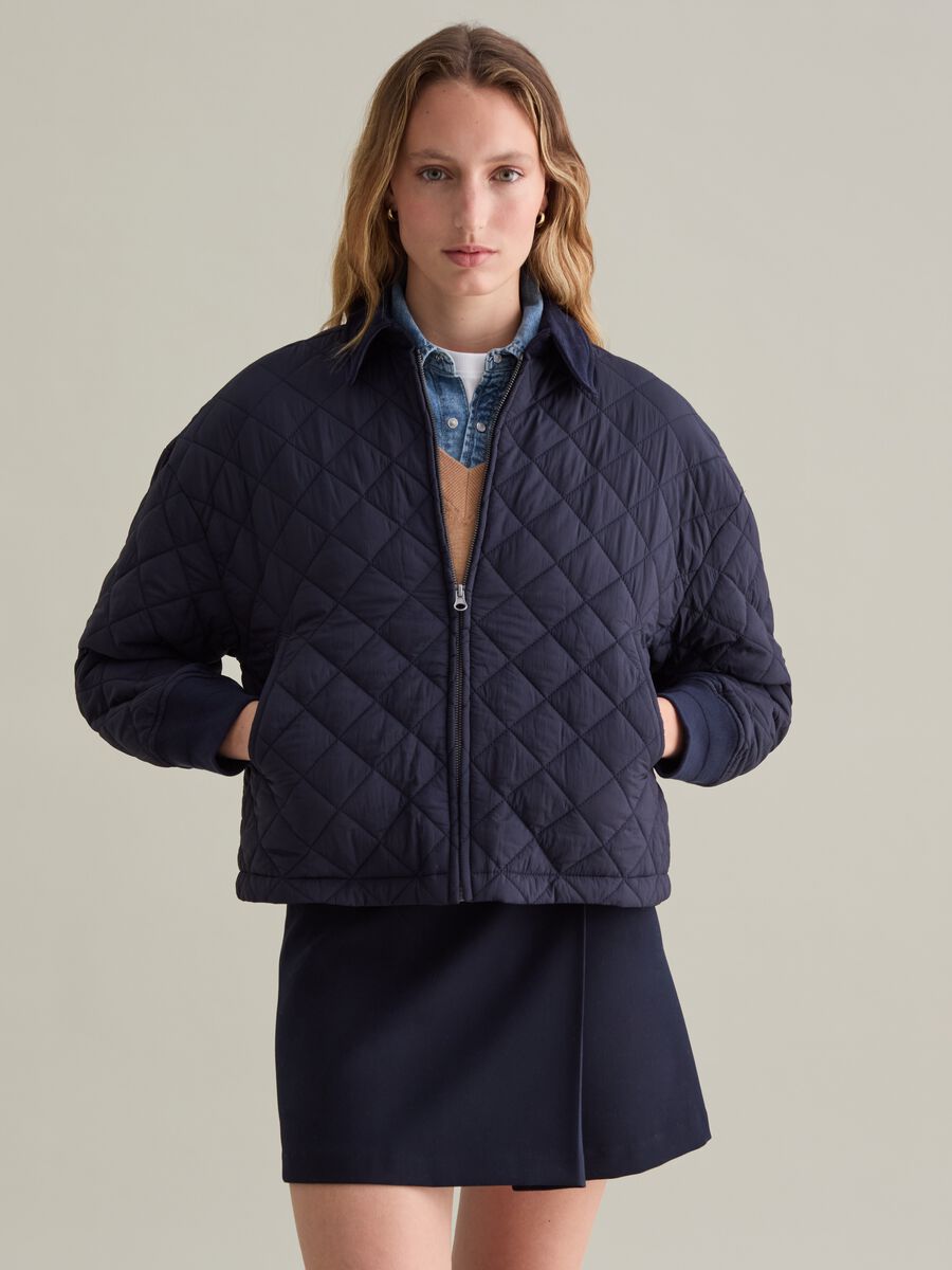 Short quilted jacket with collar in corduroy_1