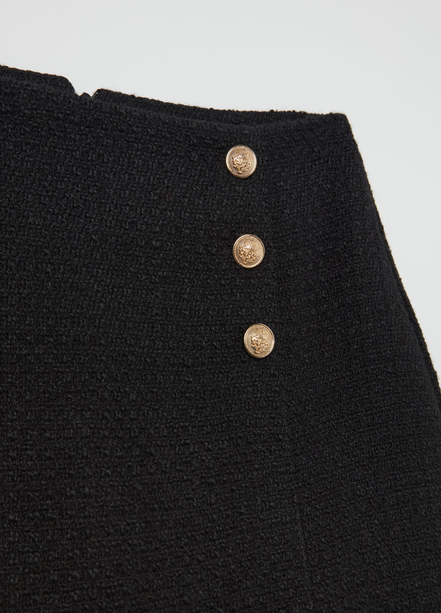 Contemporary tweed miniskirt with buttons