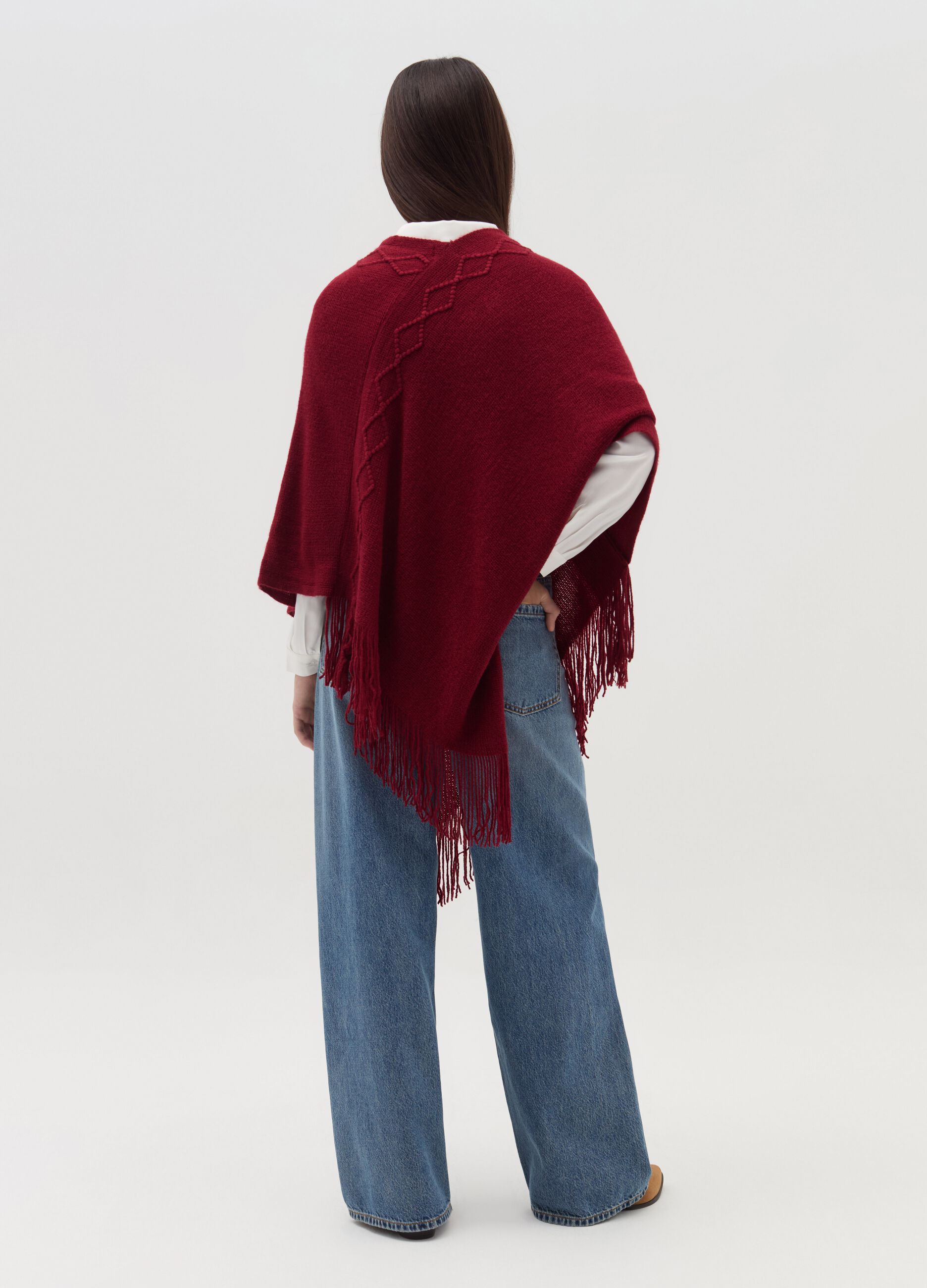 Poncho with diamond design and fringing