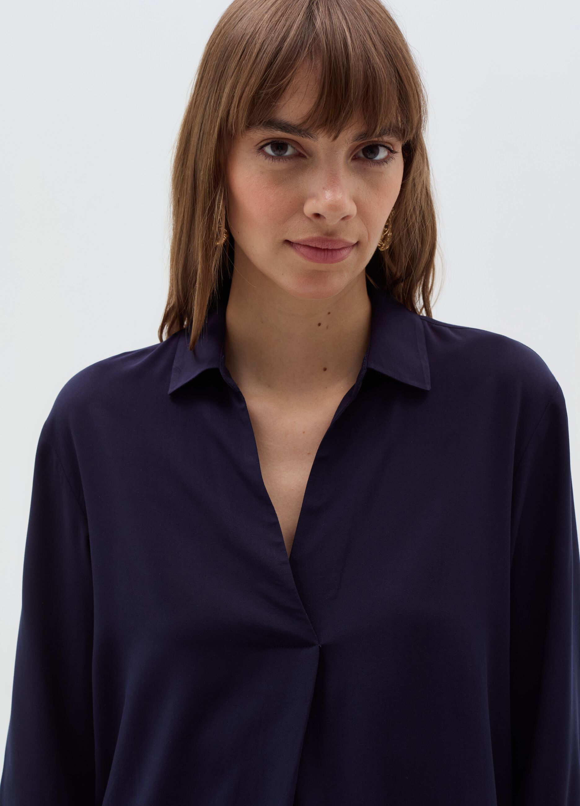 Blouse with polo neckline and long sleeves