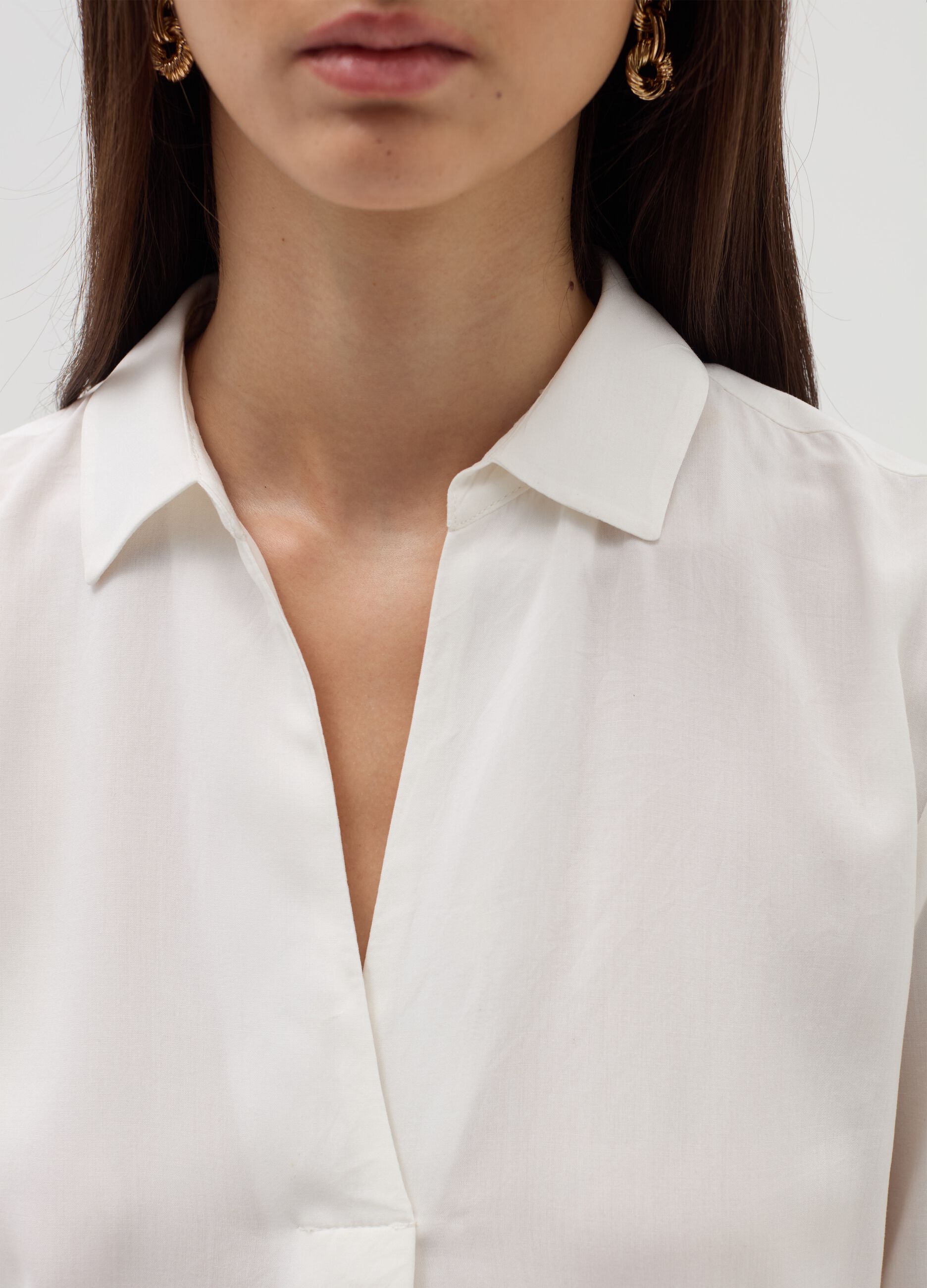 Blouse with polo neckline and long sleeves