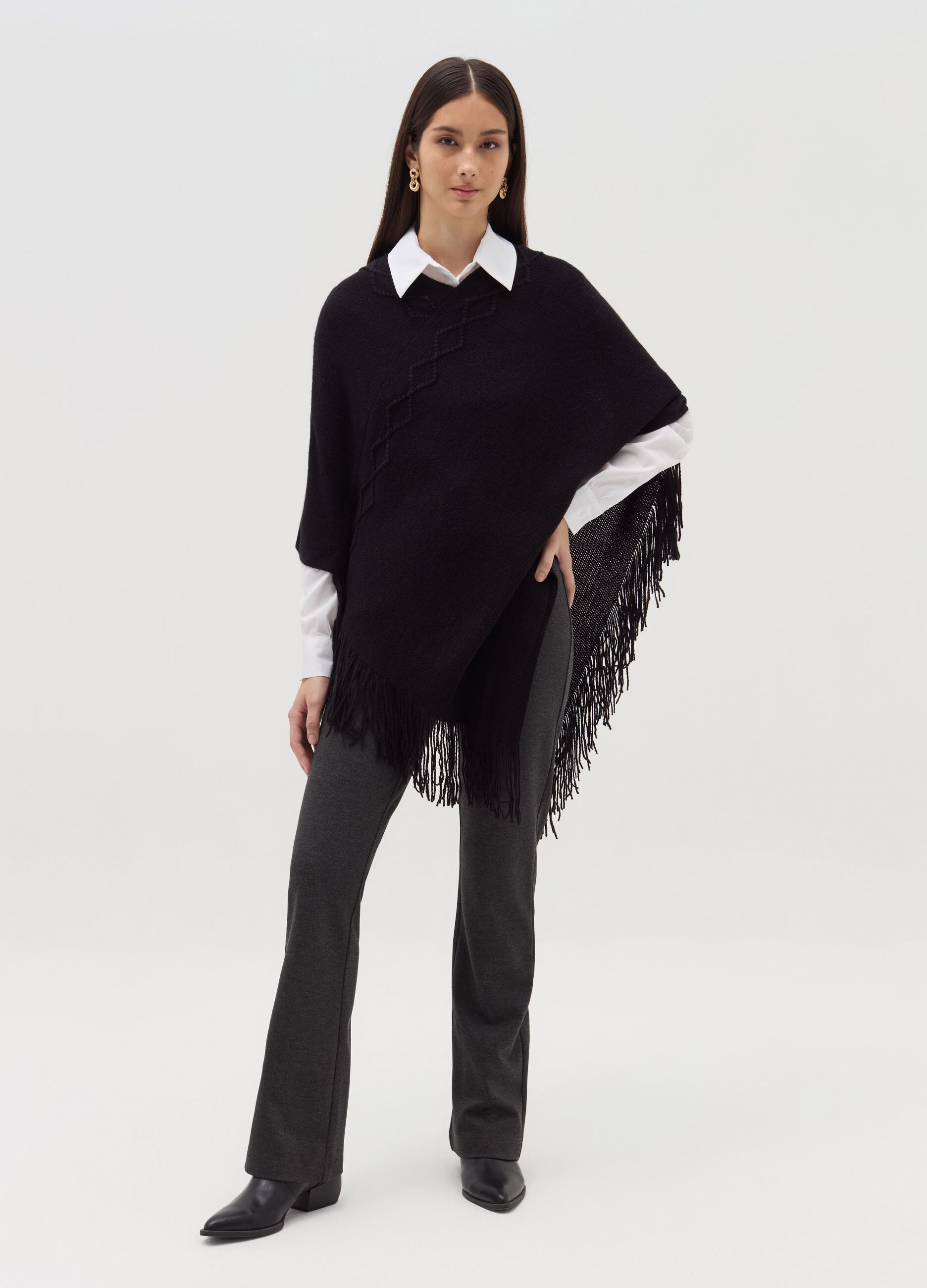 Poncho with diamond design and fringing