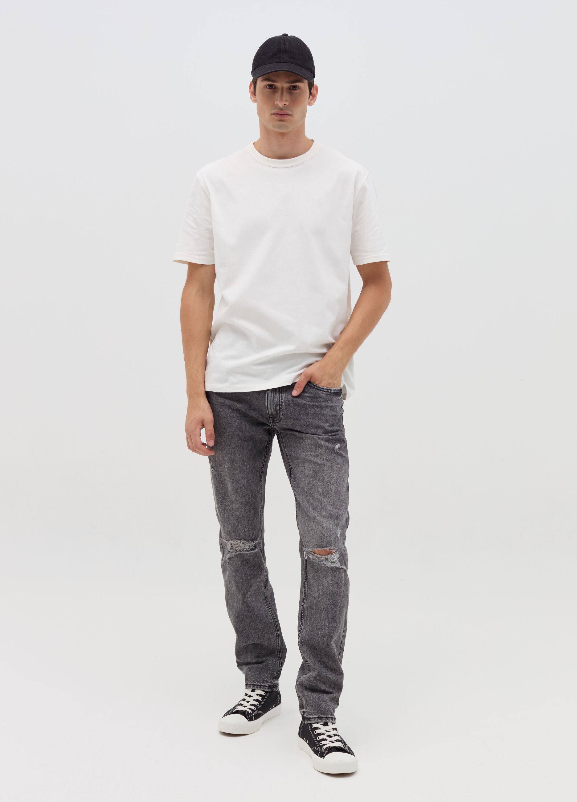 Slim-fit acid-wash jeans with abrasions