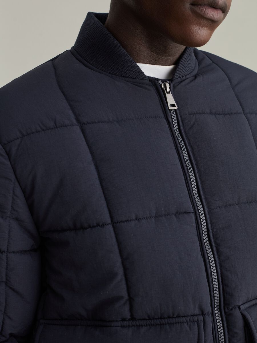 Quilted down jacket with REPREVE® padding_3