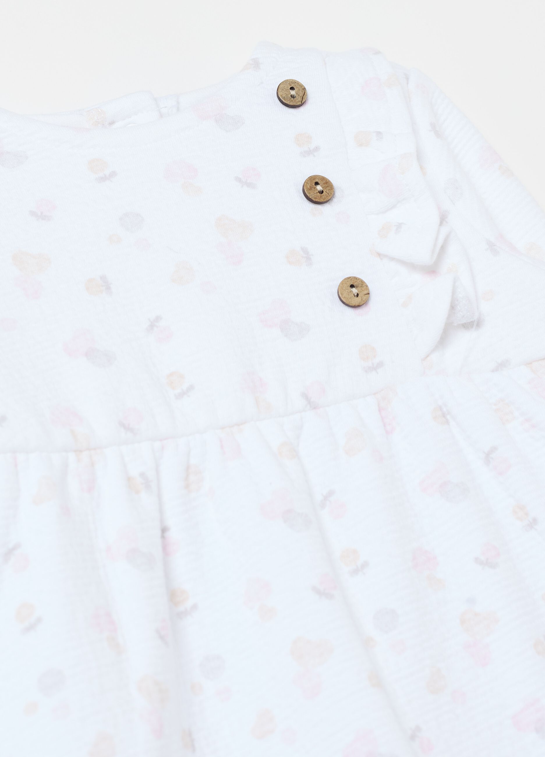 Onesie with feet and fruit print