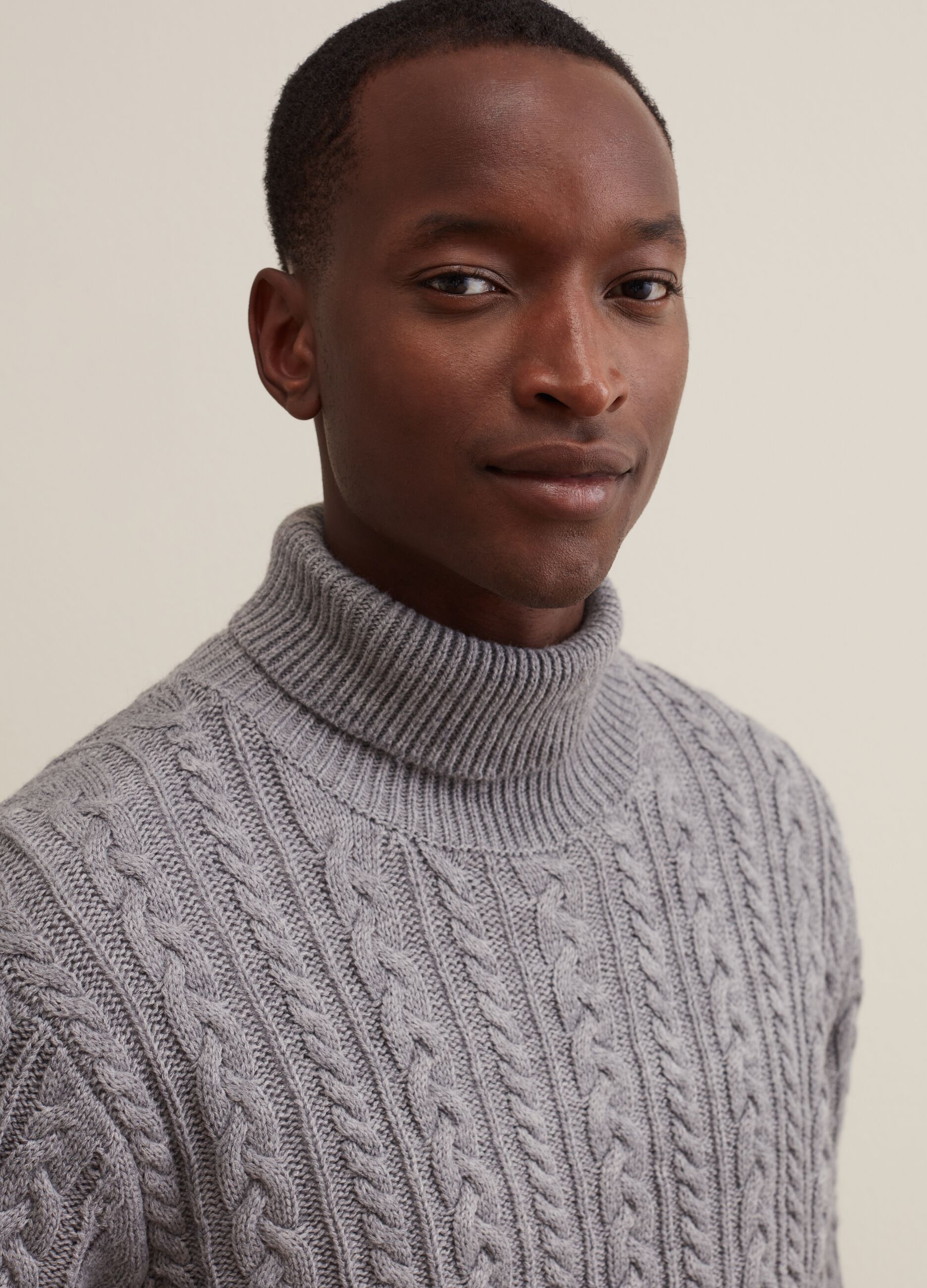 Turtleneck jumper with braided design