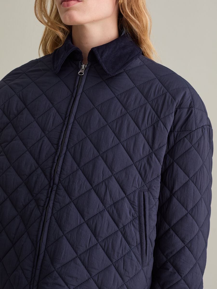 Short quilted jacket with collar in corduroy_3