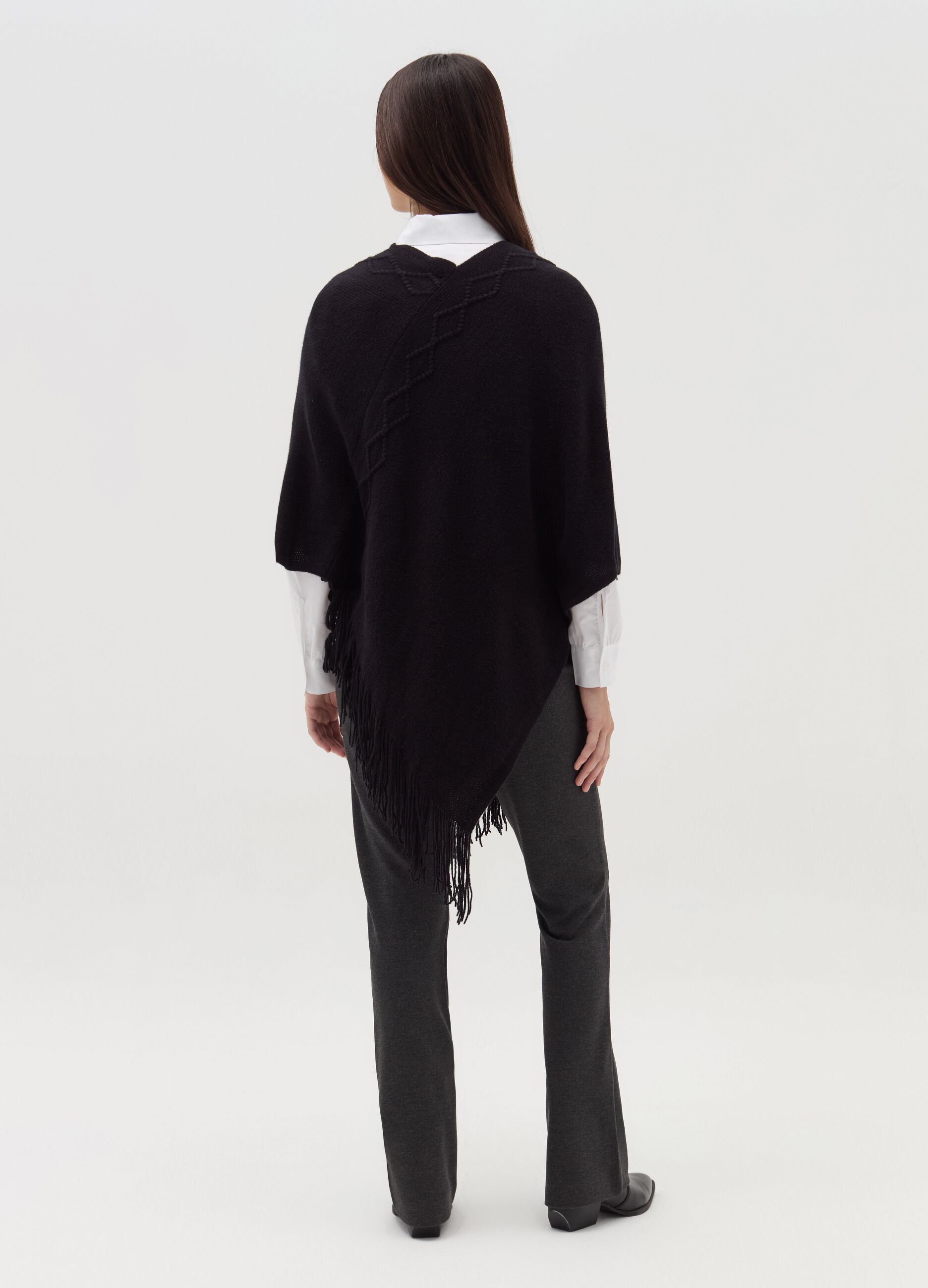 Poncho with diamond design and fringing