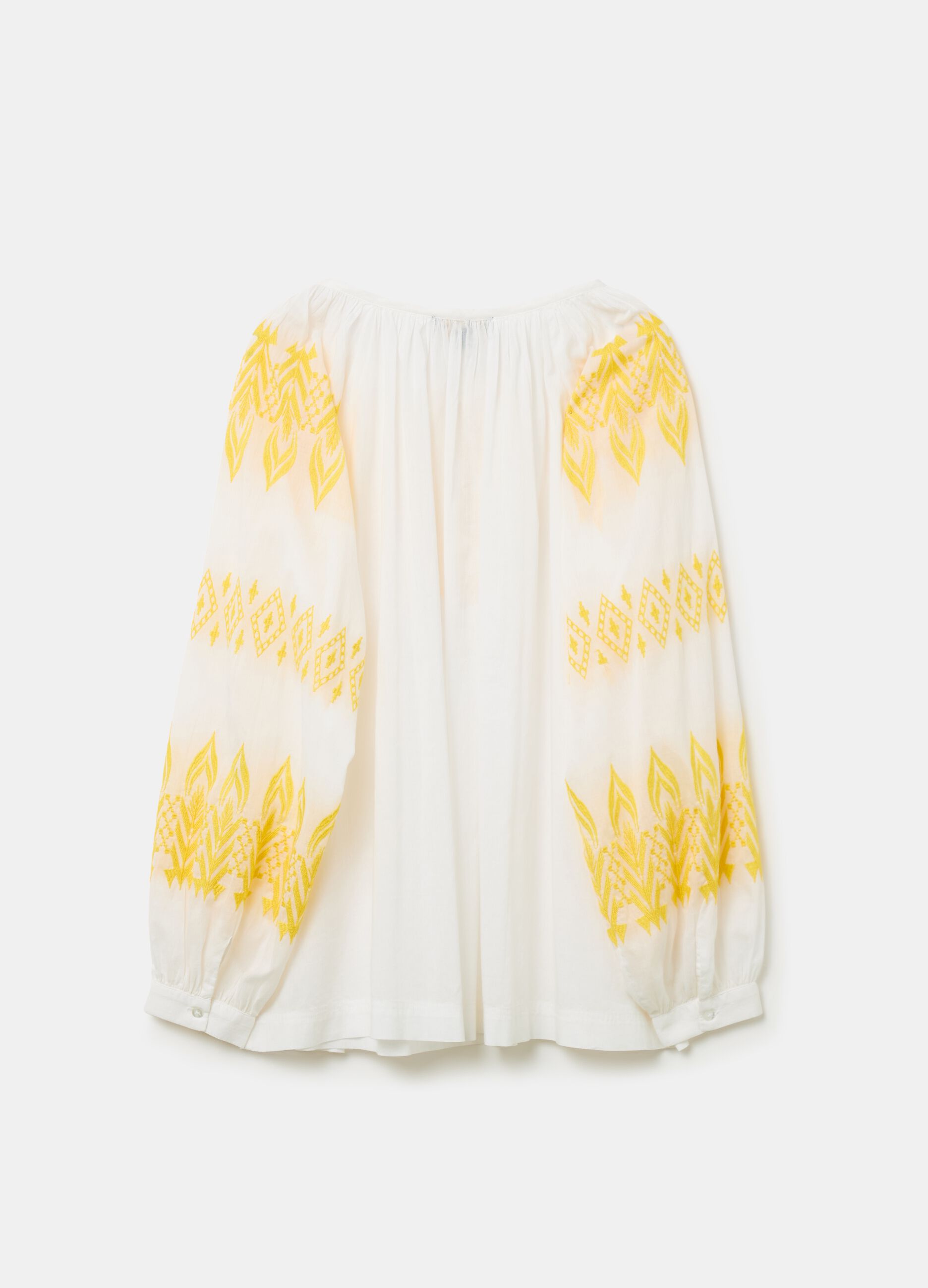 Oversized blouse with ethnic embroidery and tassels