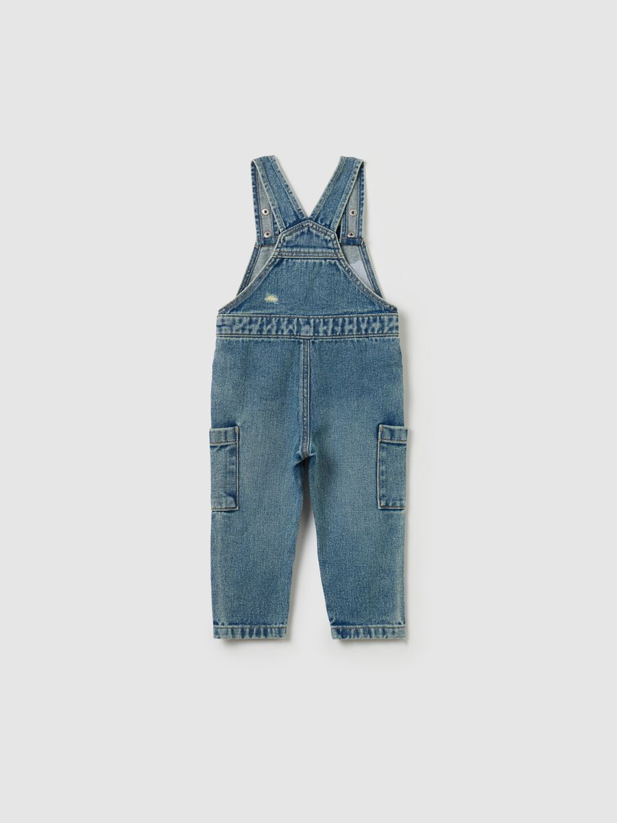 Denim dungarees with abrasions_1