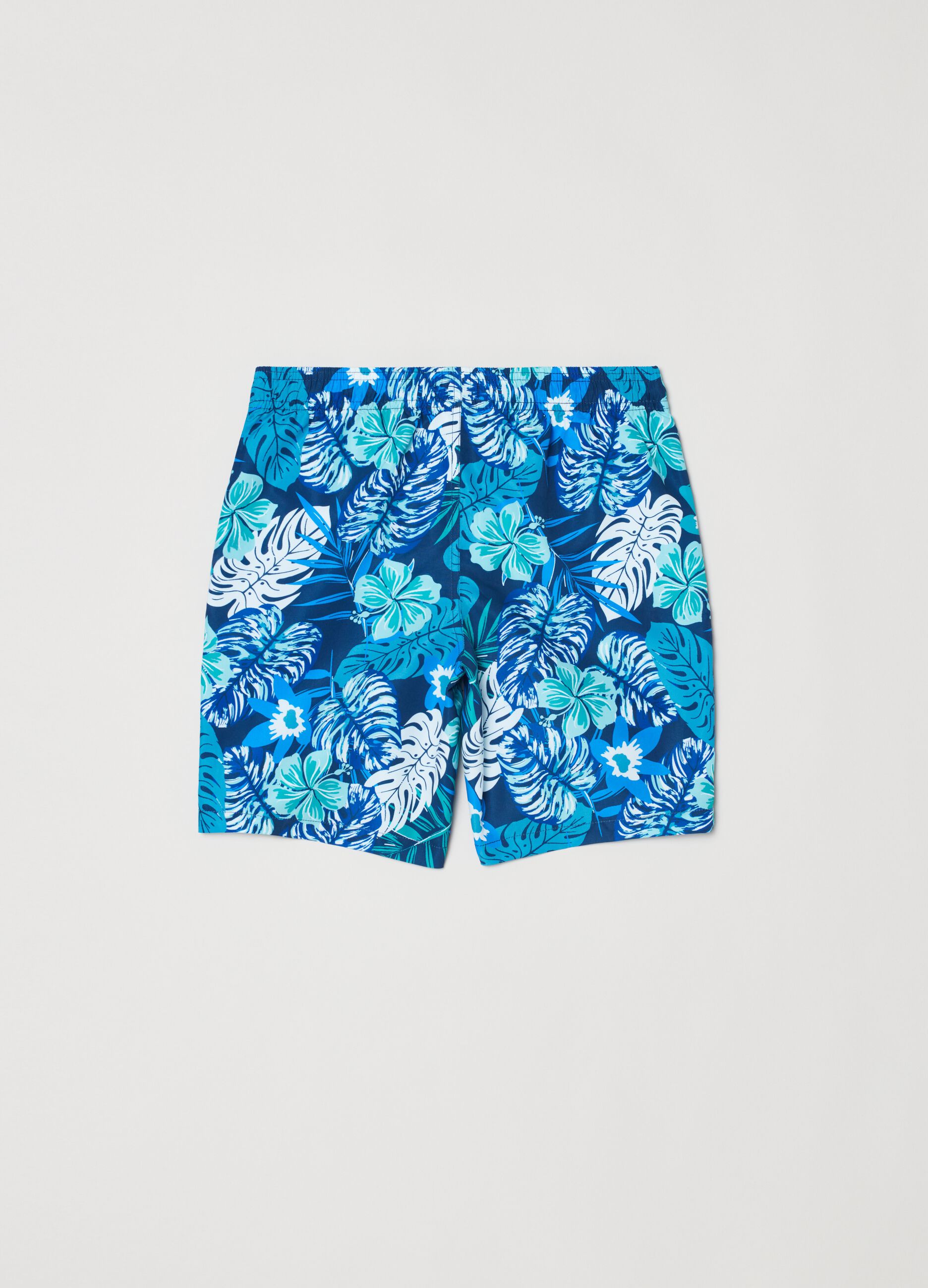 Swimming trunks with foliage print