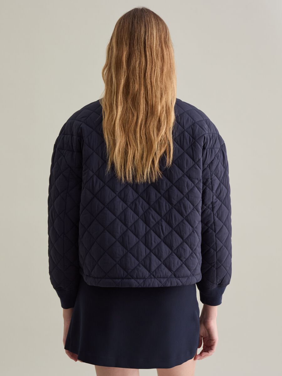 Short quilted jacket with collar in corduroy_2