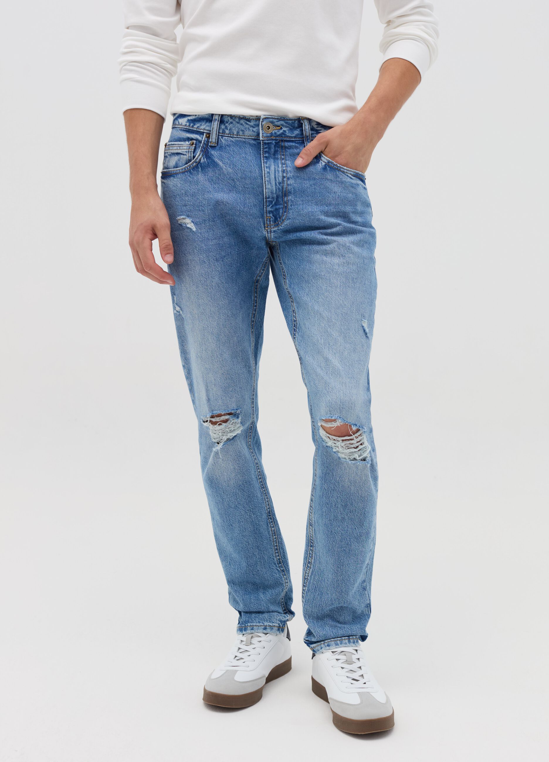 Slim-fit acid-wash jeans with abrasions