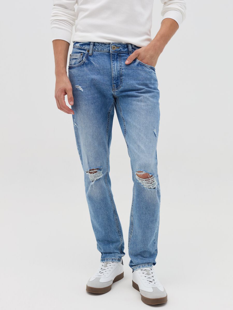 Slim-fit acid-wash jeans with abrasions_1