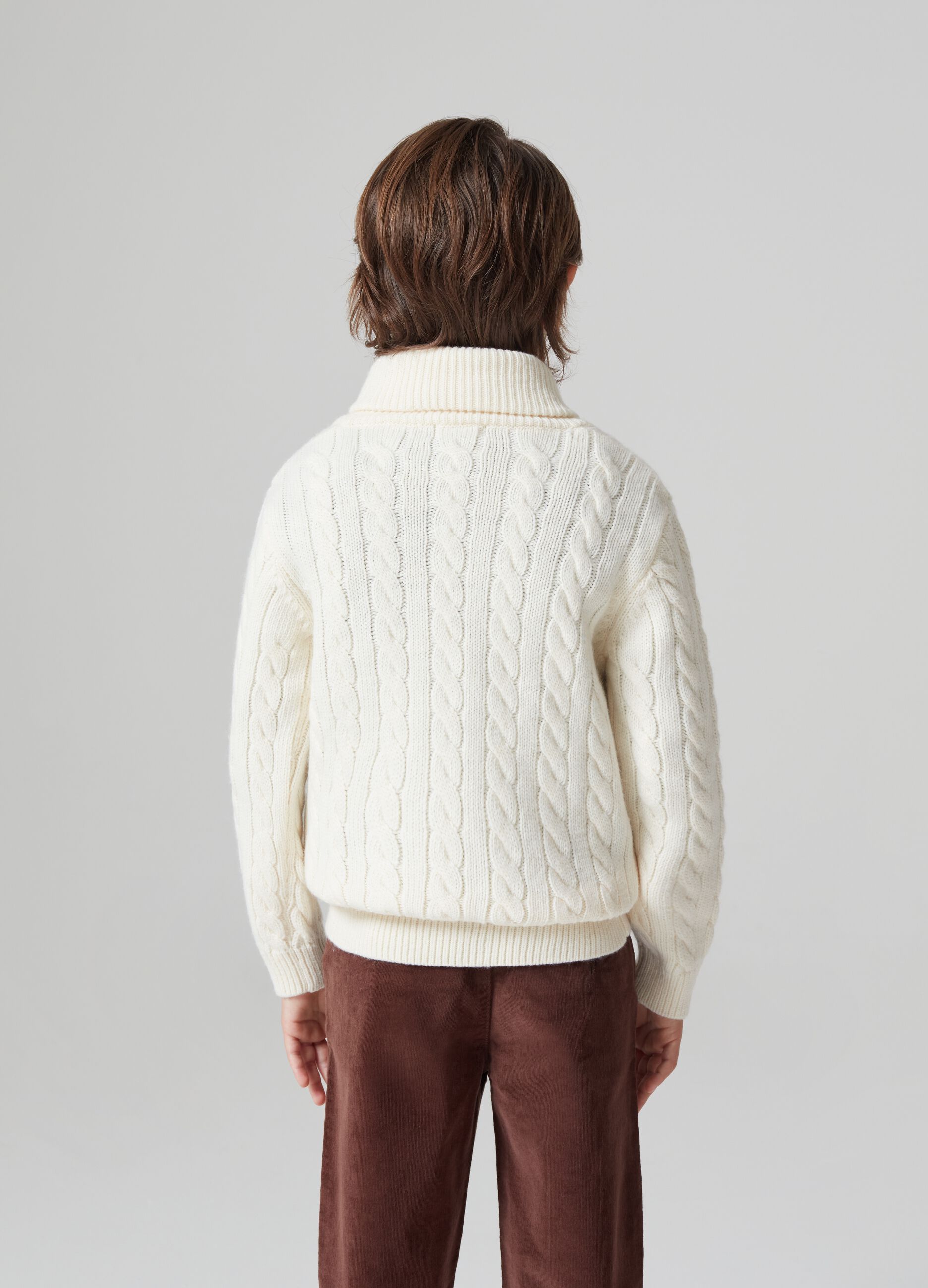 Cable knit pullover with shawl collar.