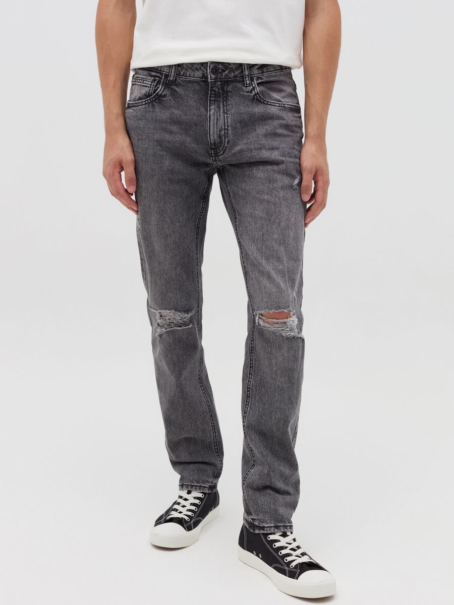 Slim-fit acid-wash jeans with abrasions_1