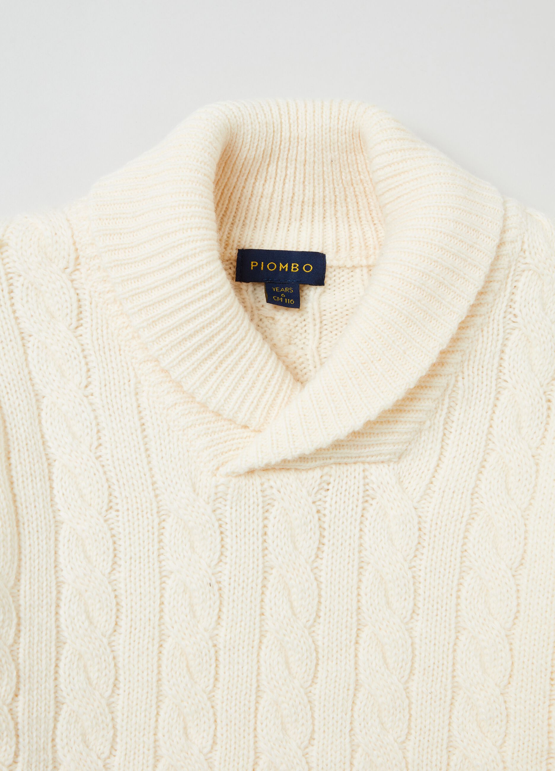 Cable knit pullover with shawl collar.