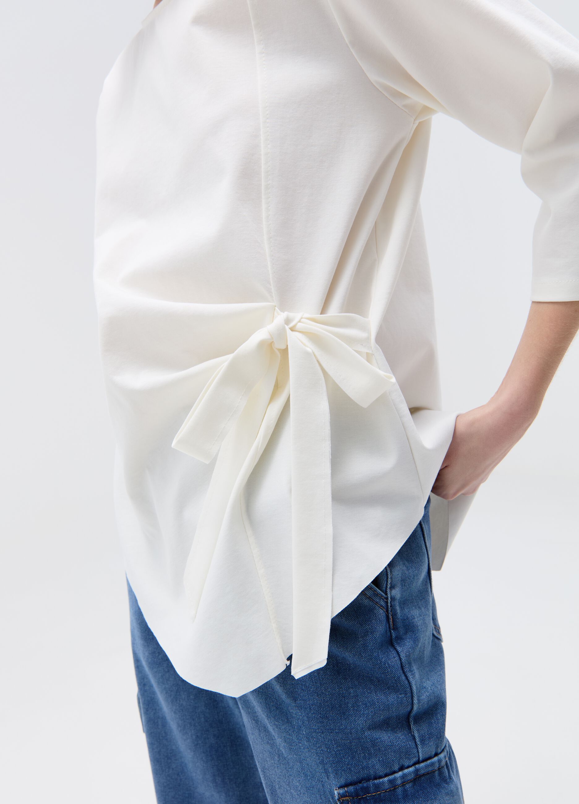 Asymmetric blouse with side bow